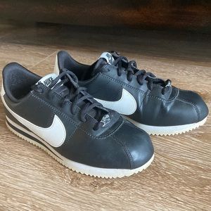 Black and white Nike Cortez sneakers
